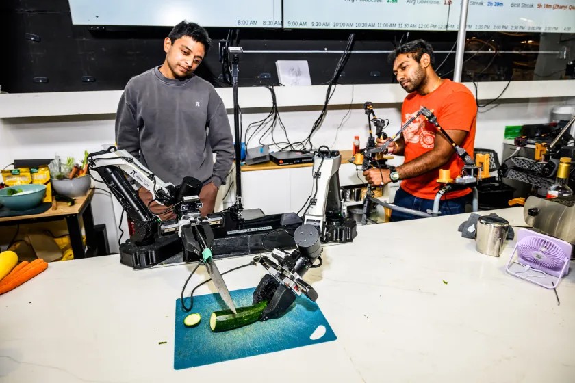 Data to train the AI can come from many sources, but one of the most important is human demonstrations. An employee at the startup controls a robot arm through teleoperation, exposing the AI to the task of slicing a zucchini.