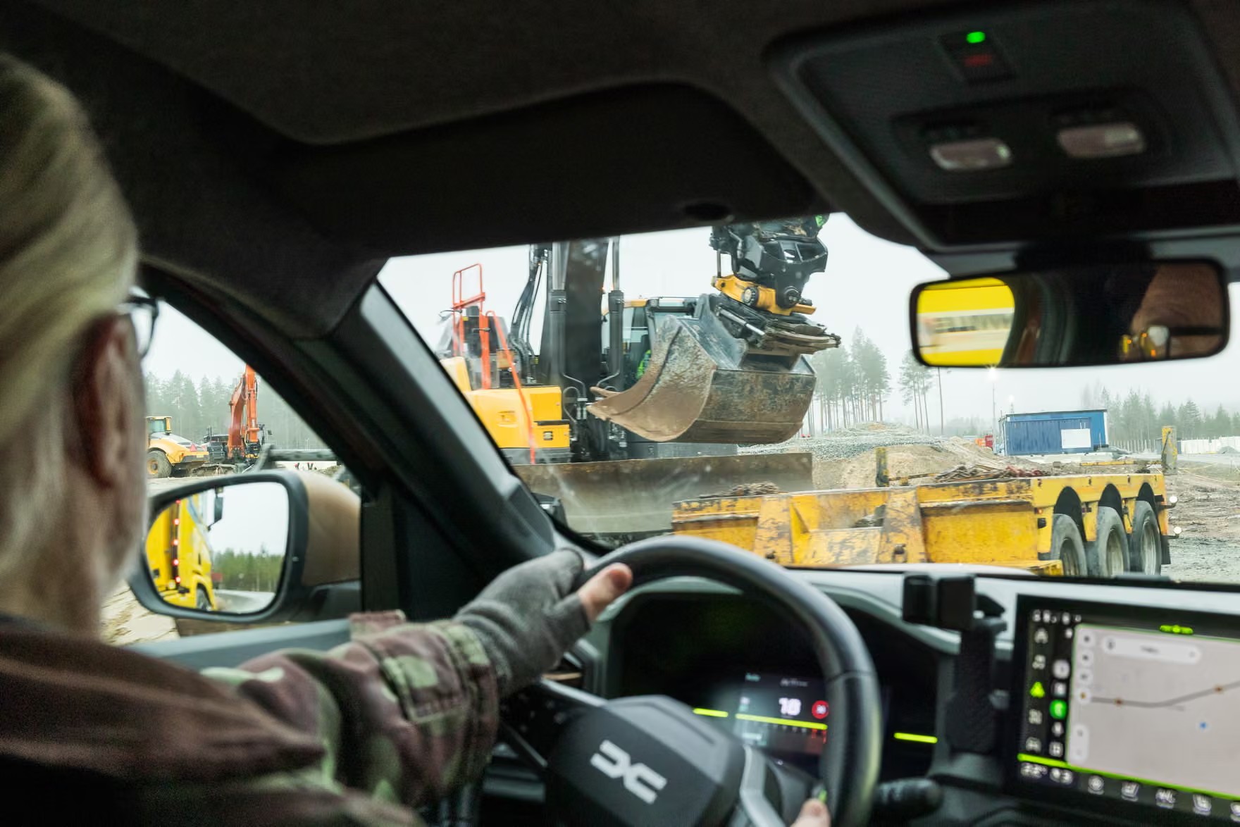 Vesa Hyyryläinen, a biologist, drives past the construction area next to the Google clearcuts in Otanmäki. Photograph: Jarno Artika/The Guardian