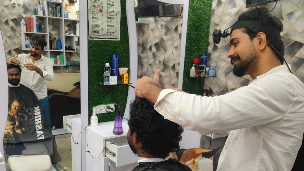 Image caption, Mohammed Ashim is paid to film his hands at work