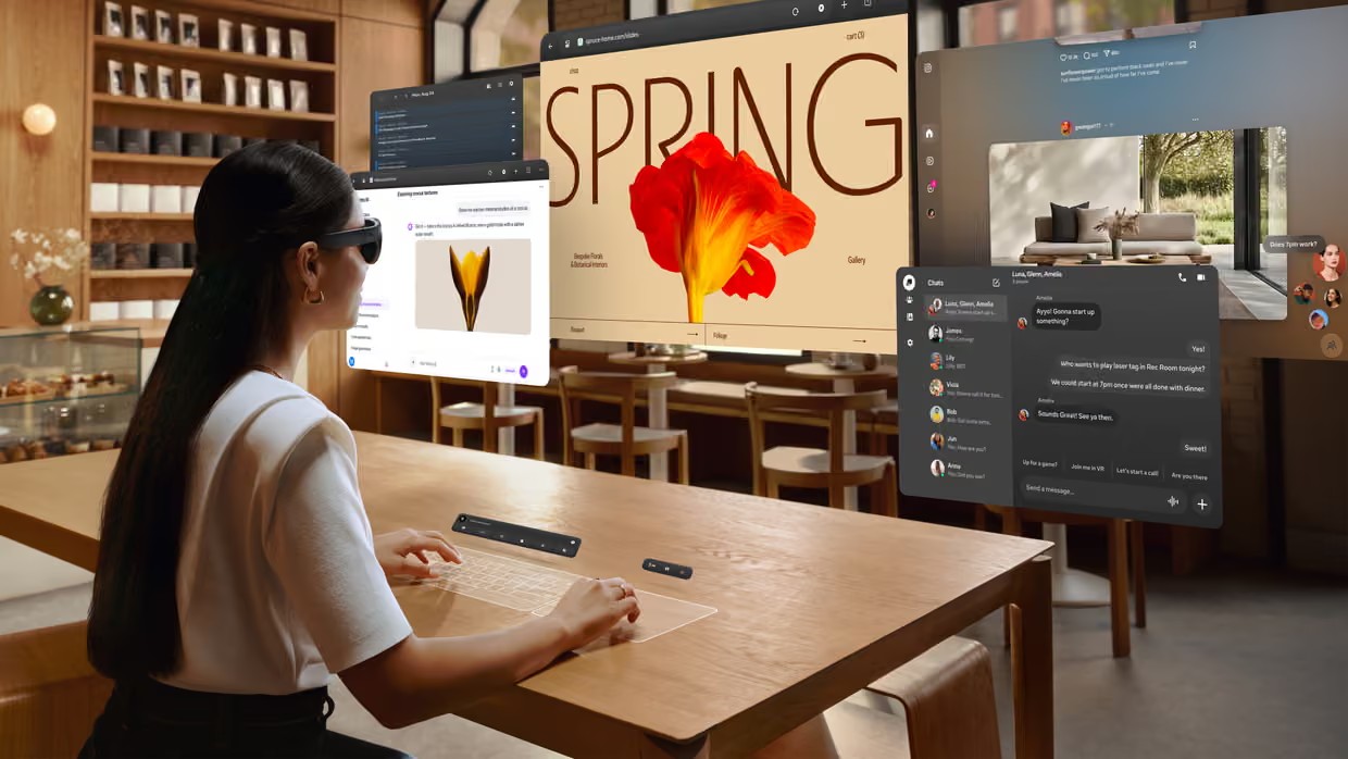 A woman works with multiple virtual windows in a cafe wearing the Meta VR glasses. Composite: Meta