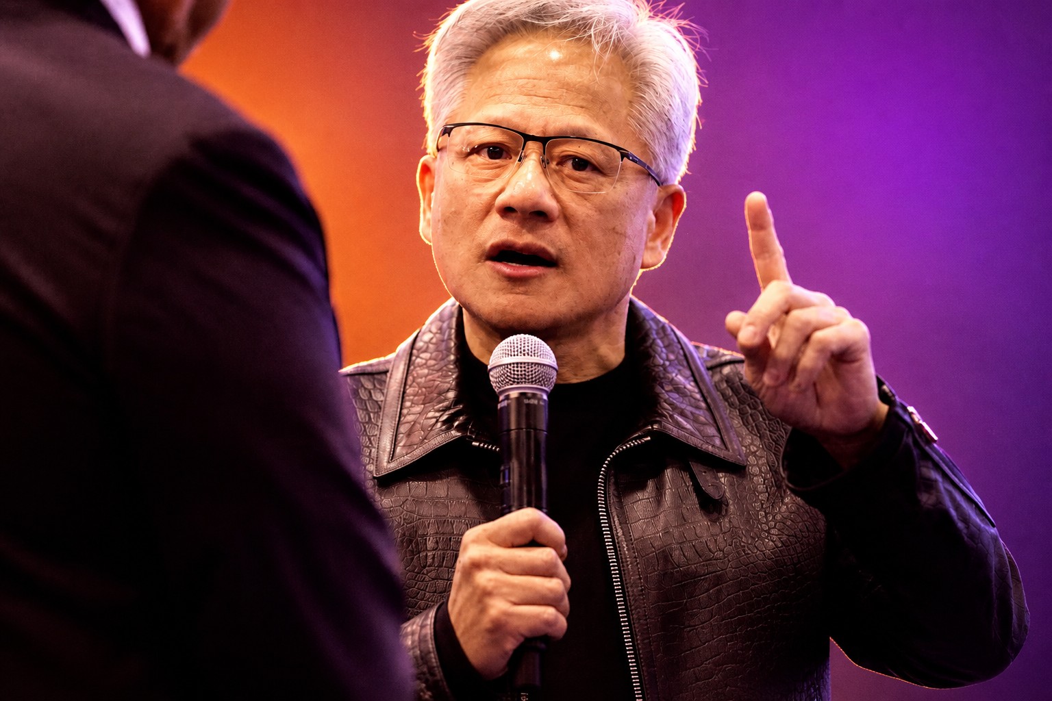 Cover: Nvidia’s Huang puts AI liability back on the labs