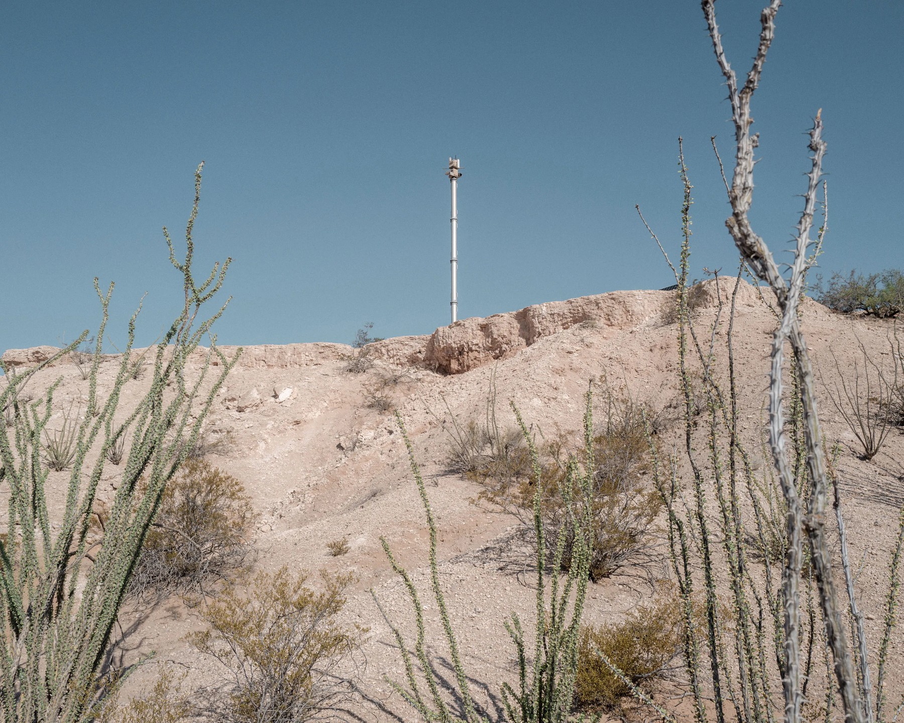An autonomous surveillance tower stands along the US-Mexico border. With billions in new funding, CBP plans to deploy thousands more surveillance towers in the coming years.